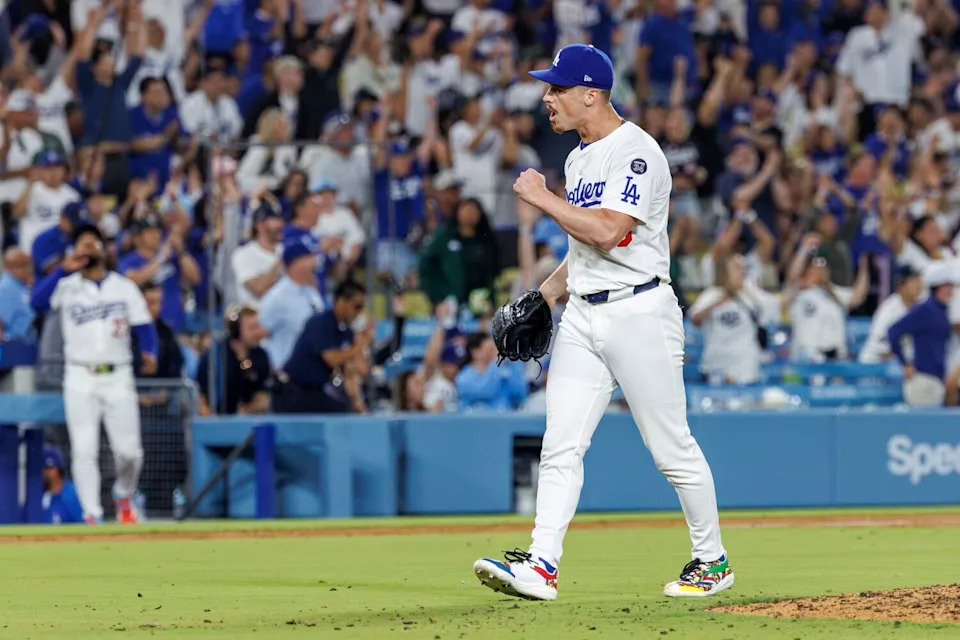 Dodgers relief pitcher Jack Dreyer celebrates after the final out of a 3-2 win over the San Diego Padres.