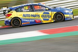 Sutton defeats Ingram in crash-strewn finale