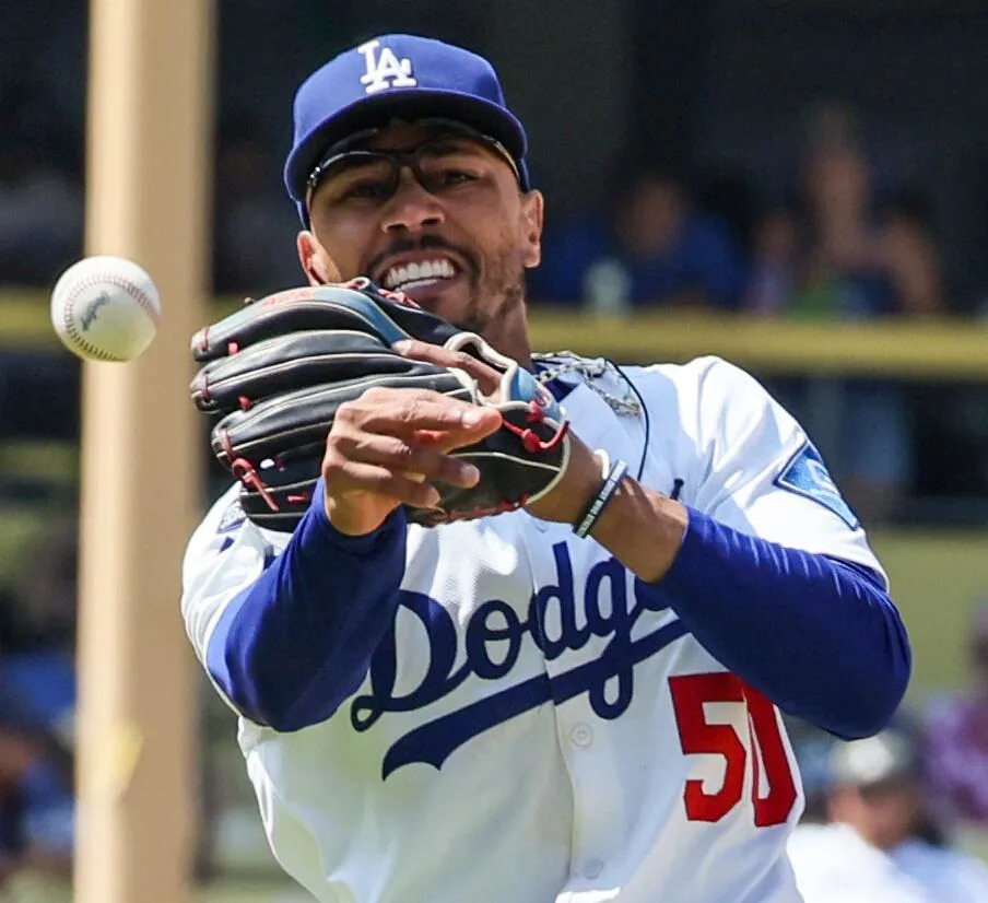 Dodgers shortstop Mookie Betts throws out Milwaukee's Caleb Durbin at first base on July 20.