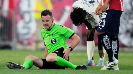 Referee helped off pitch by doctors and grimaces in pain after suffering injury in MLS competition