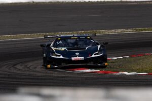 Aitken wins red-flagged race to take points lead