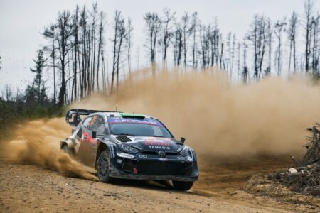 Evans takes the lead after wet weather masterclass