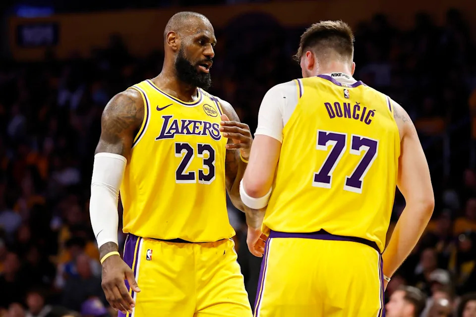 LOS ANGELES, CALIFORNIA - FEBRUARY 10: LeBron James #23 and Luka Doncic.