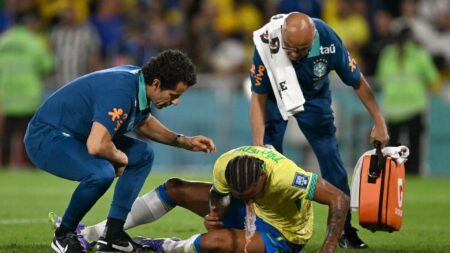 Worrying moment Joao Pedro VOMITS on pitch after colliding with own team-mate Martinelli leaves Chelsea fans concerned