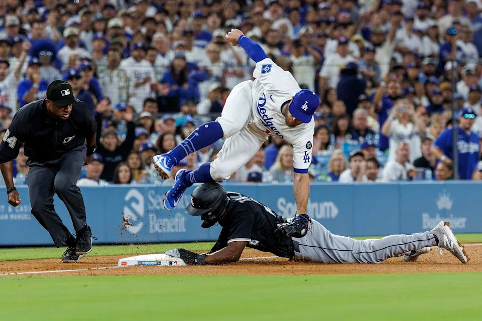 Dodgers third base Max Muncy is injured while tagging out Chicago White Sox outfielder Michael A. Taylor.