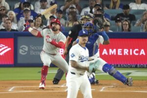 Dodgers fall to Phillies in extra innings, hindering their playoff bye chances