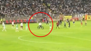 Bizarre moment ex-Man Utd boss seen riding an E-BIKE across pitch at half-time during World Cup qualifier