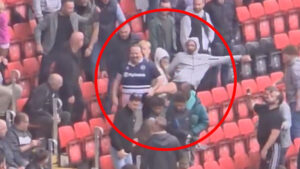 Shocking moment Millwall fan is punched and kicked before being dragged away by security in Charlton home end