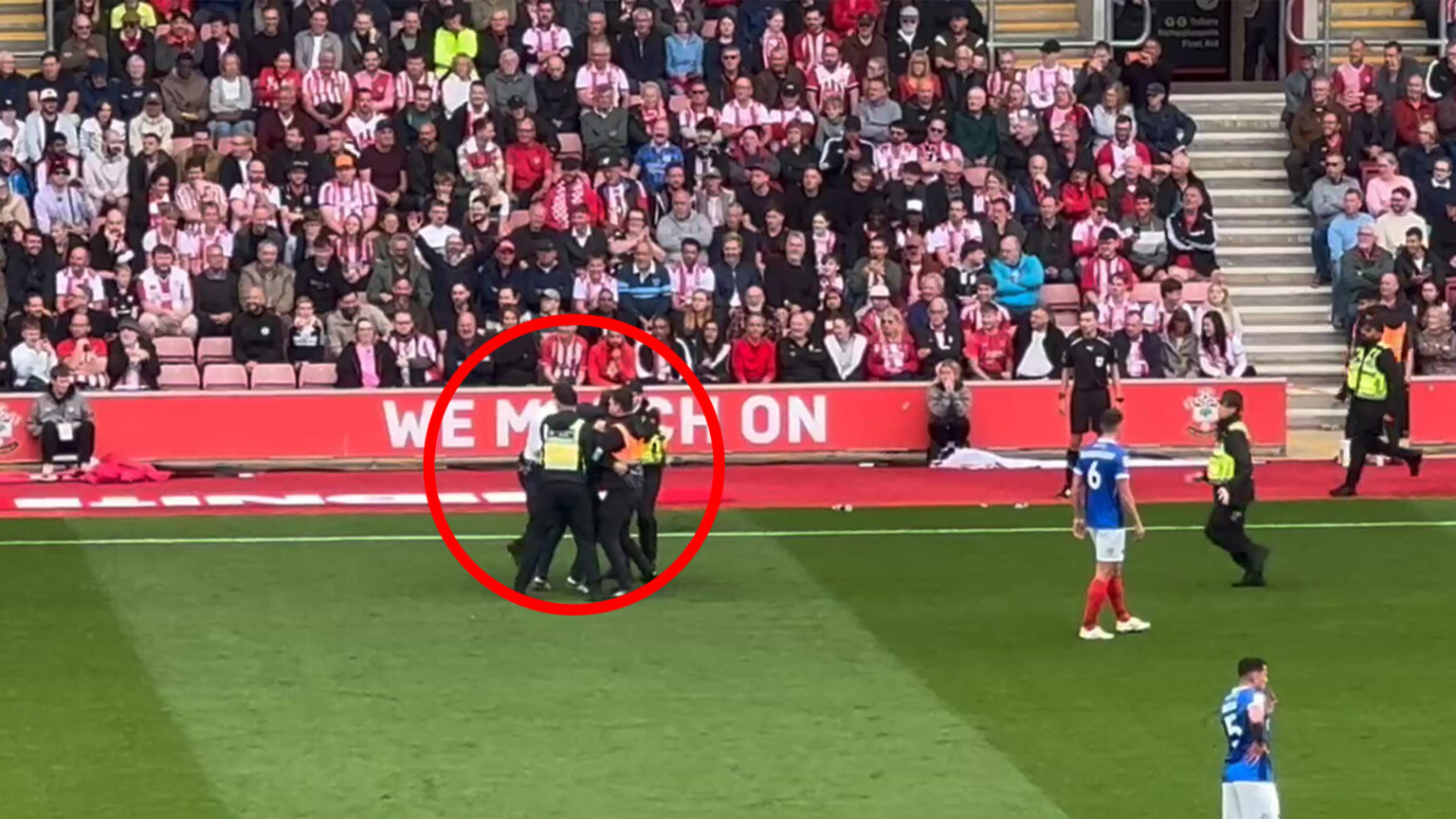 Southampton vs Portsmouth paused as pitch invader evades security before being dragged off by eight police and staff