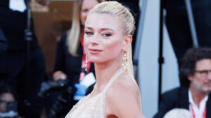 Tennis star who quit to become lingerie model before disappearing returns to Italy for glam red carpet appearance