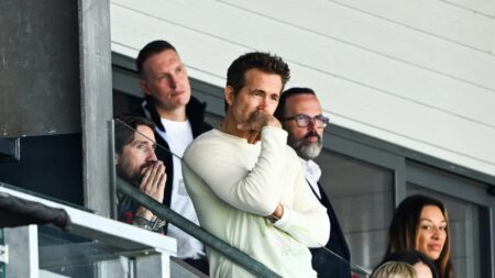 Wrexham’s Hollywood owner Ryan Reynolds jets in for QPR clash but fans can’t believe who’s stood behind him