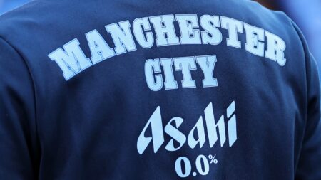 Man City REMOVE worker from Etihad after raging fans caught him wearing Man Utd shirt while pulling pints