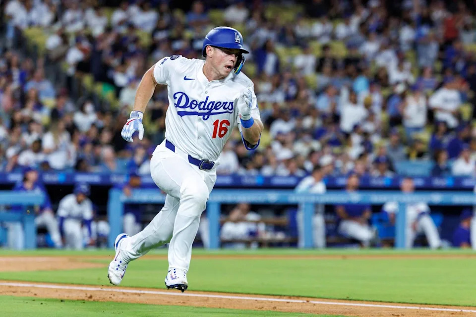 Dodgers catcher Will Smith sprints to first after hitting a double against the Colorado Rockies.
