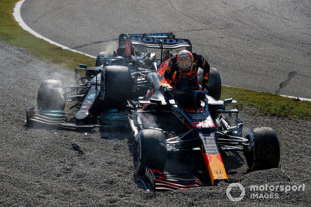 Lewis Hamilton, Mercedes W12, and Max Verstappen, Red Bull Racing RB16B, crash out of the race