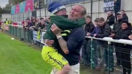 Wholesome moment Robbie Savage carries young fan to celebrate on the pitch with team after Forest Green Rovers win