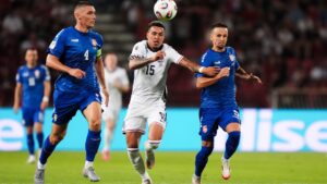 Premier League star gets budget flight home from England’s win over Serbia and chats with fans about performance