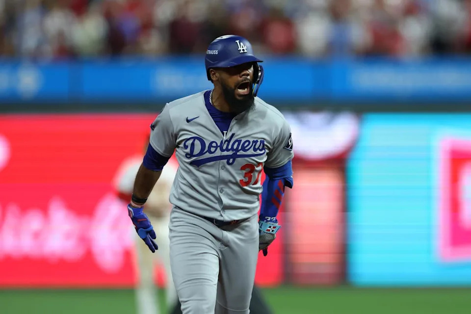 Teoscar Hernández celebrates after hitting a three-run home run against the Phillies.