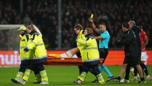 Watch bizarre moment Go Ahead Eagles star given yellow card… as he gets STRETCHERED OFF pitch vs Aston Villa