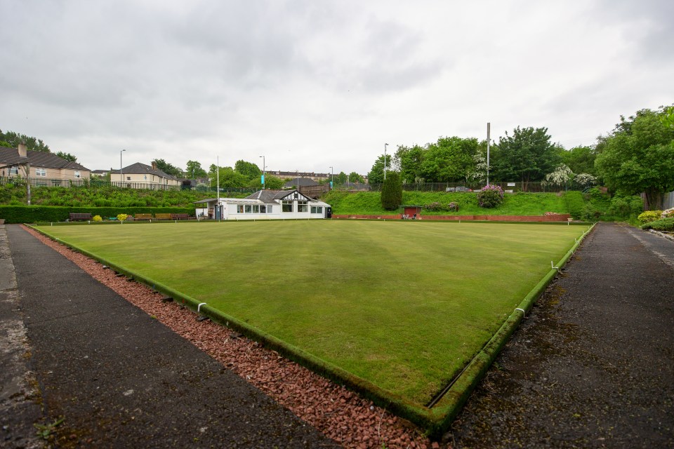 Hampden Bowling Club on the site of the original Hampden Park, with a bowling green in the foreground and the club building behind it.