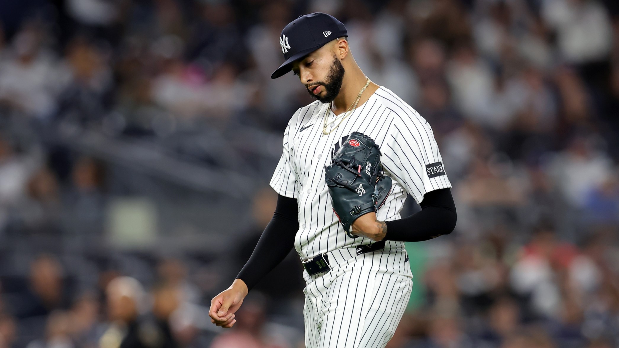 Apr 25, 2025; Bronx, New York, USA; New York Yankees relief pitcher Devin Williams (38) reacts as he walks off the field after being taken out of the game against the Toronto Blue Jays during the ninth inning at Yankee Stadium.