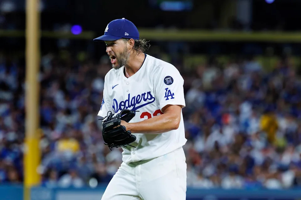 Dodgers pitcher Clayton Kershaw celebrates after getting San Francisco's Jerar Encarnacion to hit into a double play.