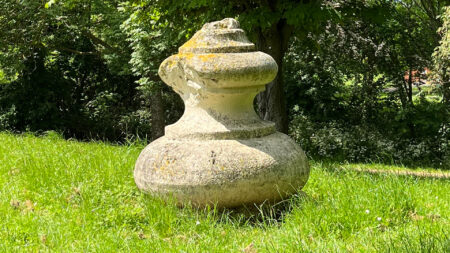 Iconic landmark from former stadium now lies in a London park with passers by not even glancing at the forgotten relic