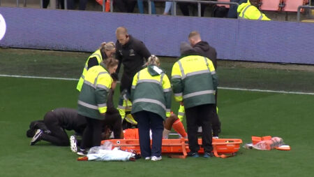 Blackpool star Michael Ihiekwe placed in neck brace and carried off on stretcher after very concerning injury