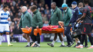Millwall star Massimo Luongo carried off on stretcher against QPR as all four stands applaud stricken midfielder