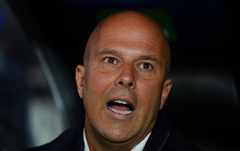 Close-up of a bald man with his mouth open.