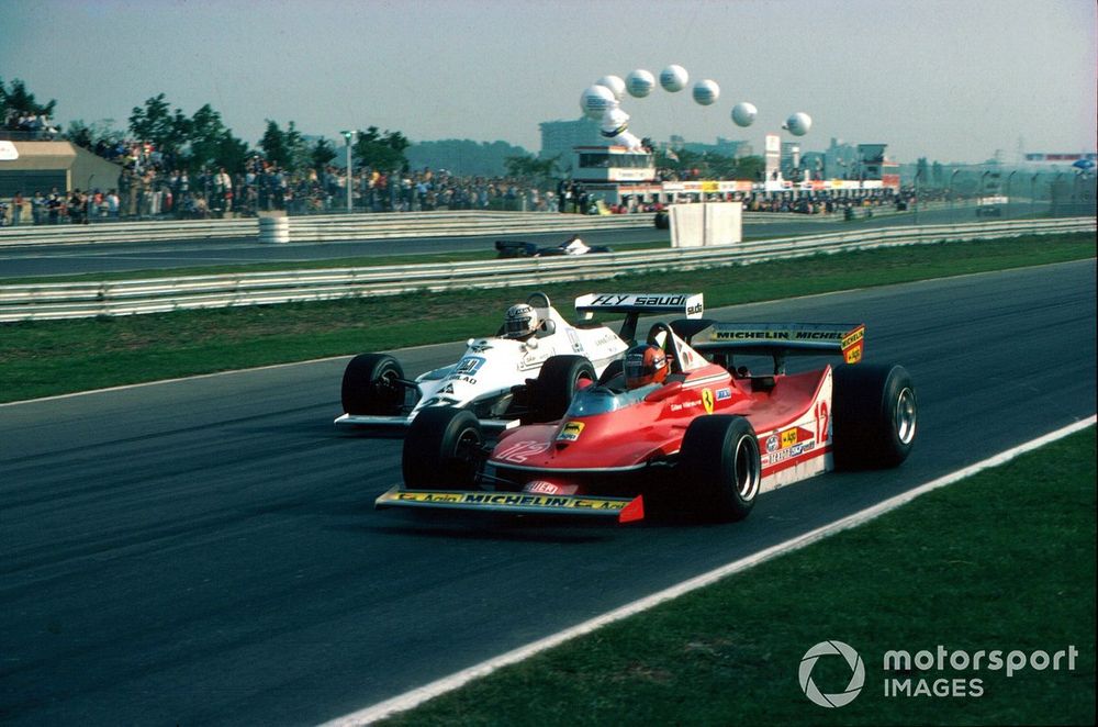 Alan Jones, WIlliams Ford FW07 passes the Ferrari 312T4 of Gilles Villeneuve