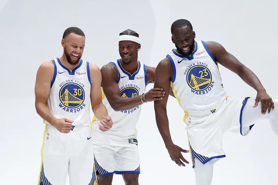 SAN FRANCISCO, CALIFORNIA - SEPTEMBER 29: Jimmy Butler III #10, Stephen Curry #30, and Draymond Green #23 of the Golden State Warriors joke around during the Golden State Warriors' media day at Chase Center on September 29, 2025 in San Francisco, California. NOTE TO USER: User expressly acknowledges and agrees that, by downloading and/or using this photograph, user is consenting to the terms and conditions of the Getty Images License Agreement. (Photo by Ezra Shaw/Getty Images)