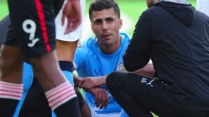 Rodri looks distraught as he’s forced off after 20 minutes vs Brentford in huge title blow for Man City