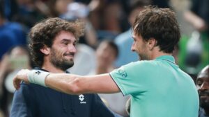 Watch tennis star break rules to hug COUSIN after booking spot to play each other in final as Medvedev rows with umpire