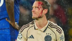 Weghorst left with blood pouring down head after collision… but laughs off ‘s*** Andy Carroll’ chant from Chelsea fans