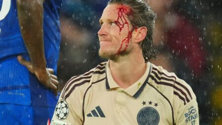 Weghorst left with blood pouring down head after collision… but laughs off ‘s*** Andy Carroll’ chant from Chelsea fans