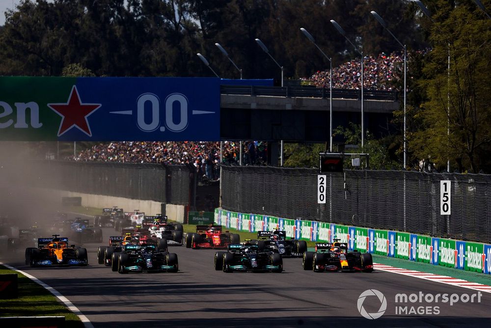 Max Verstappen, Red Bull Racing RB16B, leads Lewis Hamilton, Mercedes W12, Valtteri Bottas, Mercedes W12, Daniel Ricciardo, McLaren MCL35M, Sergio Perez, Red Bull Racing RB16B, and the rest of the field at the start