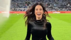Stunning DAZN presenter forced to sprint off pitch in high heels as she nearly gets soaked by sprinker