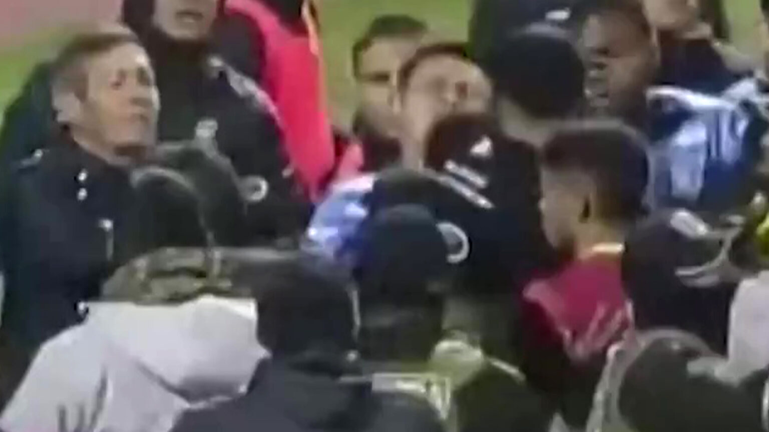 Chaos as SEVENTEEN are sent off in mass football brawl and tear gas deployed with police forced to step in