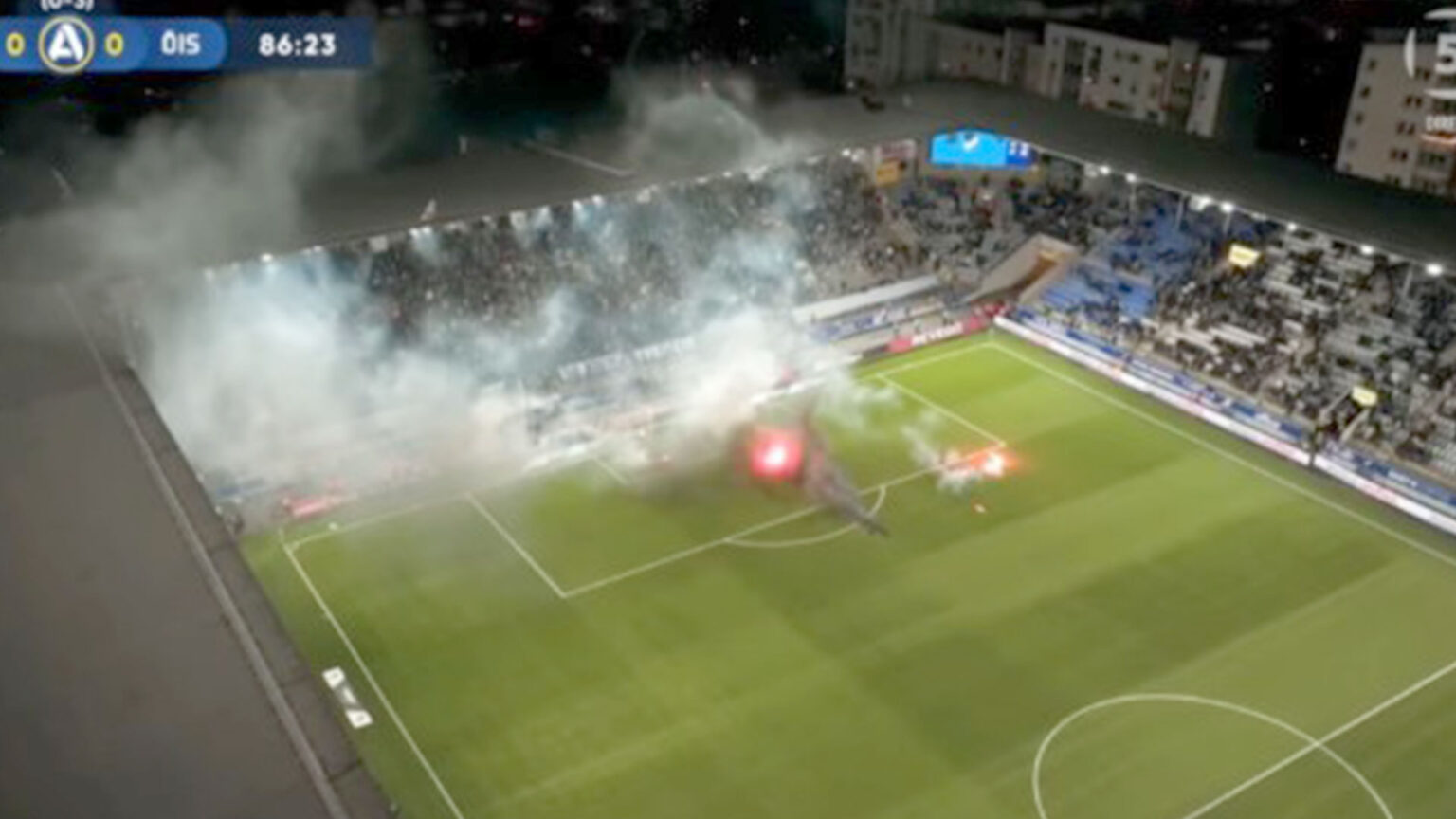 Swedish football match descends into chaos with pitch set on fire and referee hauling players off the pitch