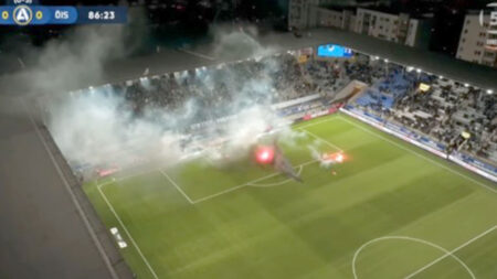 Swedish football match descends into chaos with pitch set on fire and referee hauling players off the pitch
