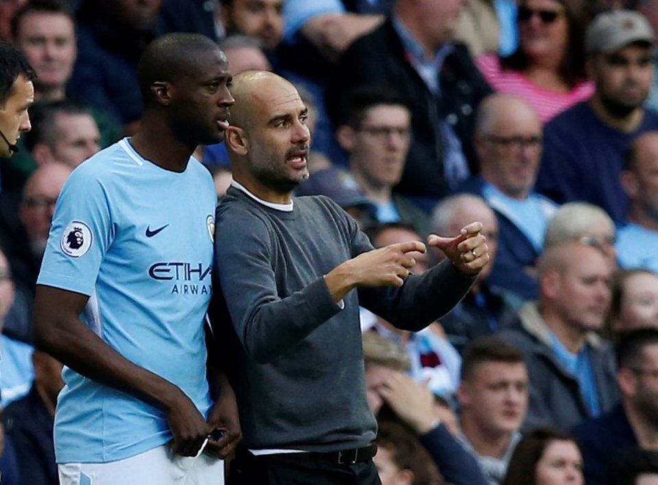 Pep Guardiola and Yaya Touré during the Manchester City vs Stoke City match.