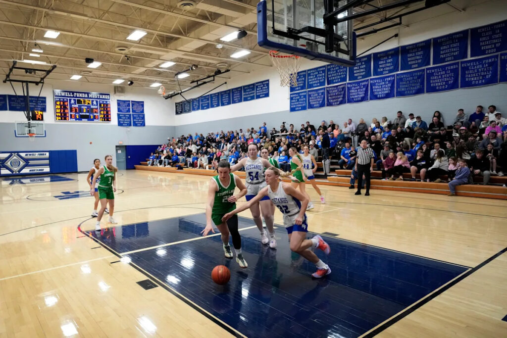 Even in Caitlin Clark’s home state, girls high school basketball in decline. It thrives in this town