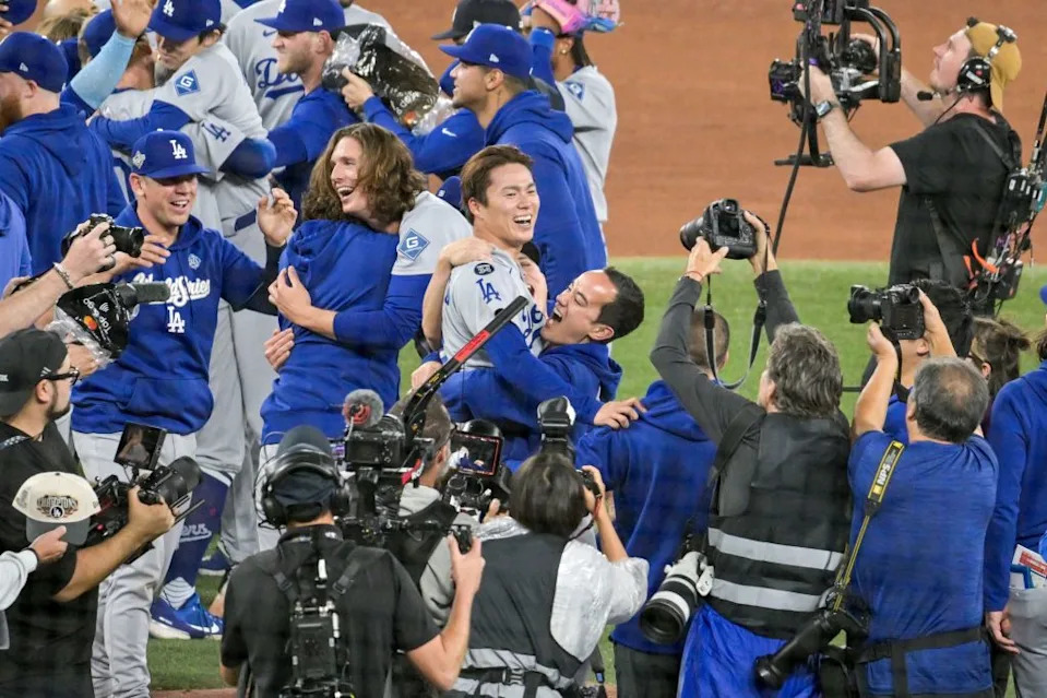 Yoshinobu Yamamoto celebrates with his teammates after the final out as the Dodgers defeated the Toronto Blue Jays. EDUARDO LIMA/EPA/Shutterstock
