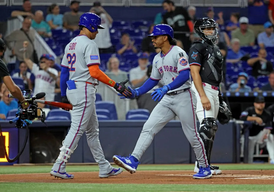 Francisco Lindor #12 of the New York Mets is greeted by Juan Soto #22 of the New York Mets after he scores on his solo home run during the first inning. Charles Wenzelberg/New York Post