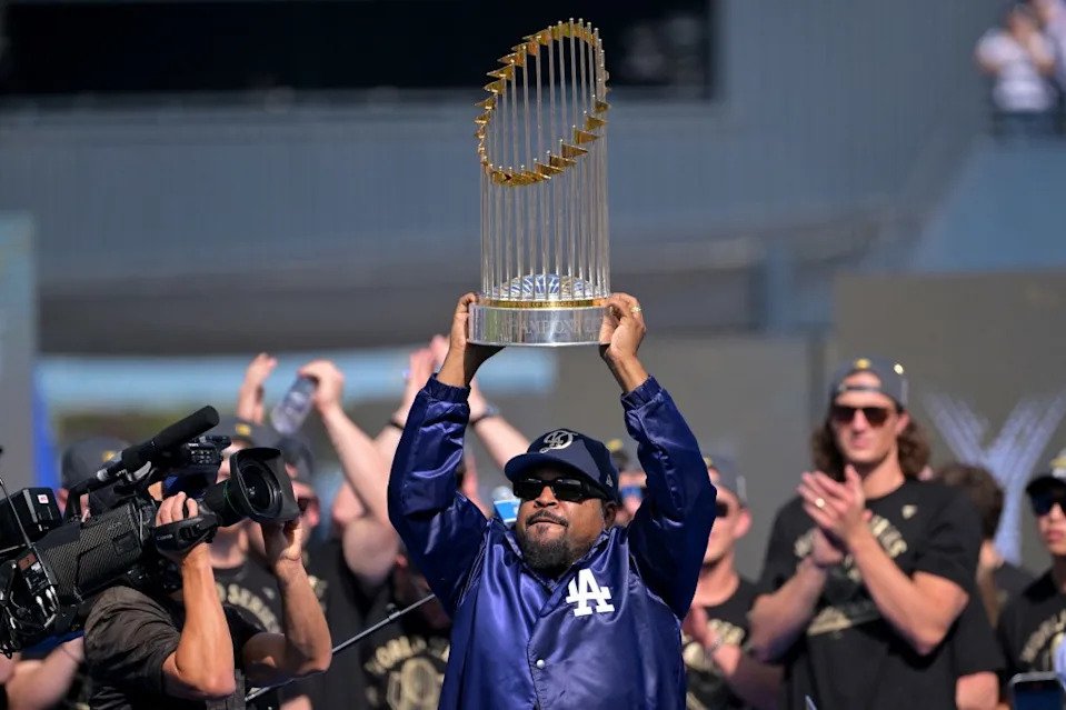 Ice Cube delivers the World Series Trophy during the victory celebration at Dodger Stadium. IMAGN IMAGES via Reuters Connect