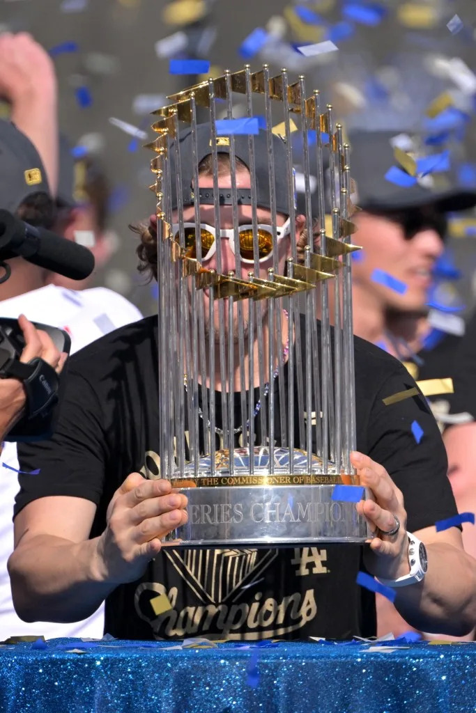 <em>Kiké</em> Hernandez holds the World Series Commissioners Trophy during the World Series celebration at Dodger Stadium. IMAGN IMAGES via Reuters Connect