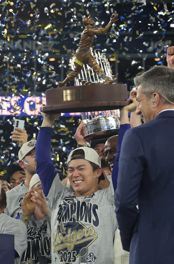 Yoshinobu Yamamoto holds the MVP award after the Dodgers defeated the Toronto Blue Jays in eleven innings in Game Seven to win the MLB World Series. Aaron Josefczyk/UPI/Shutterstock
