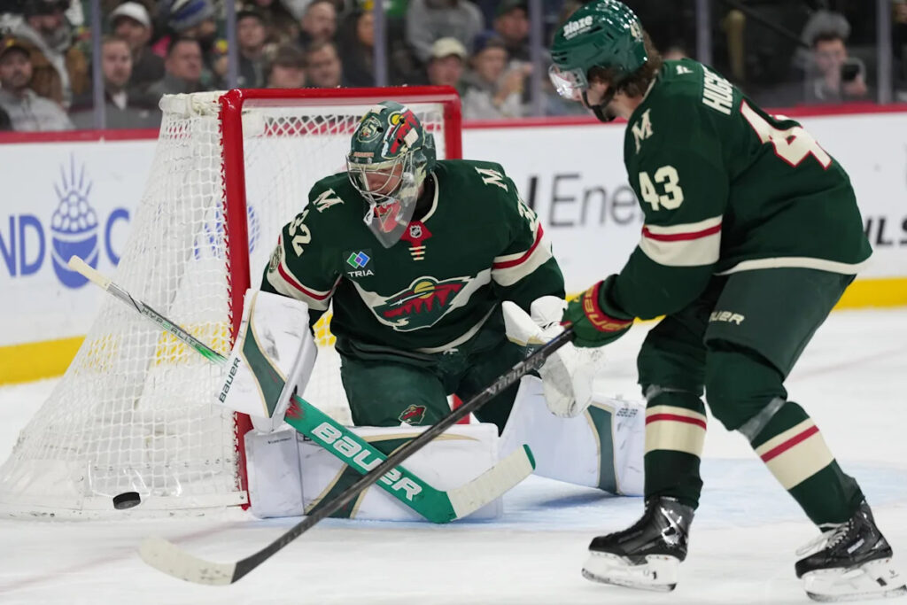 Gustavsson makes 29 saves as the Wild race to an early lead and beat the Flames 4-1