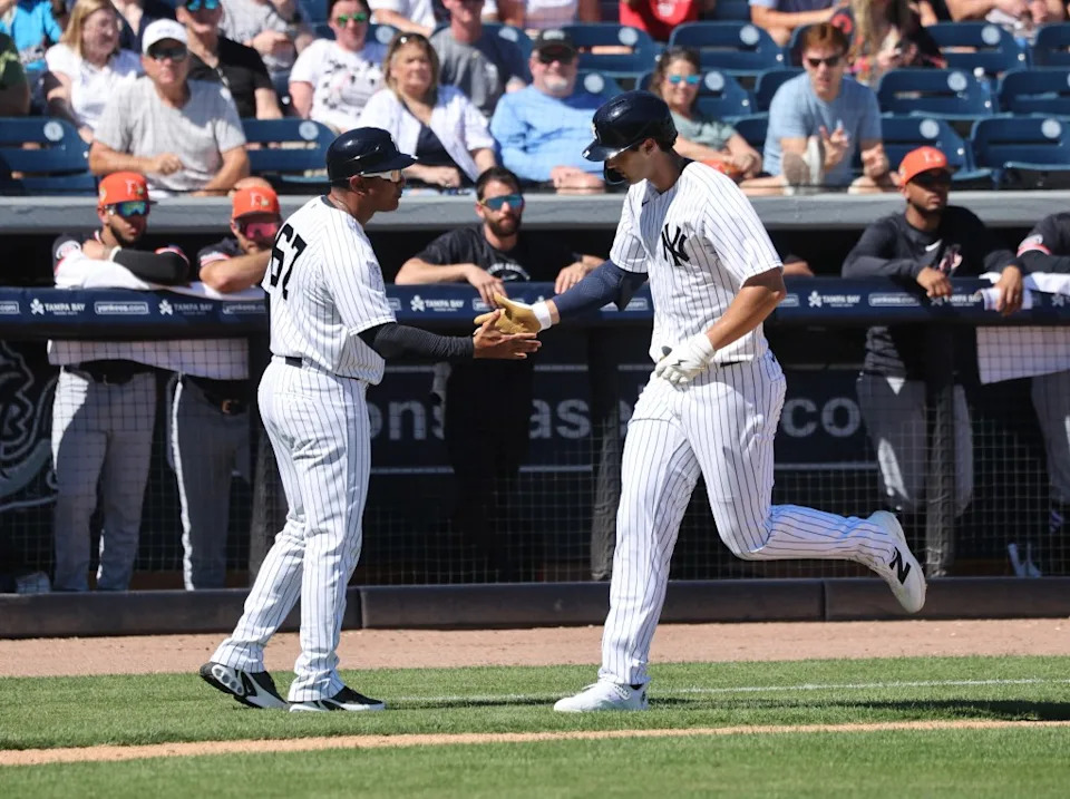 Spencer Jones slaps hands with third base/outfield coach Luis Rojas as he runs around the bases after hitting a solo homer in the second inning of the Yankees’ spring training blowout win over the Cardinals. Charles Wenzelberg / New York Post