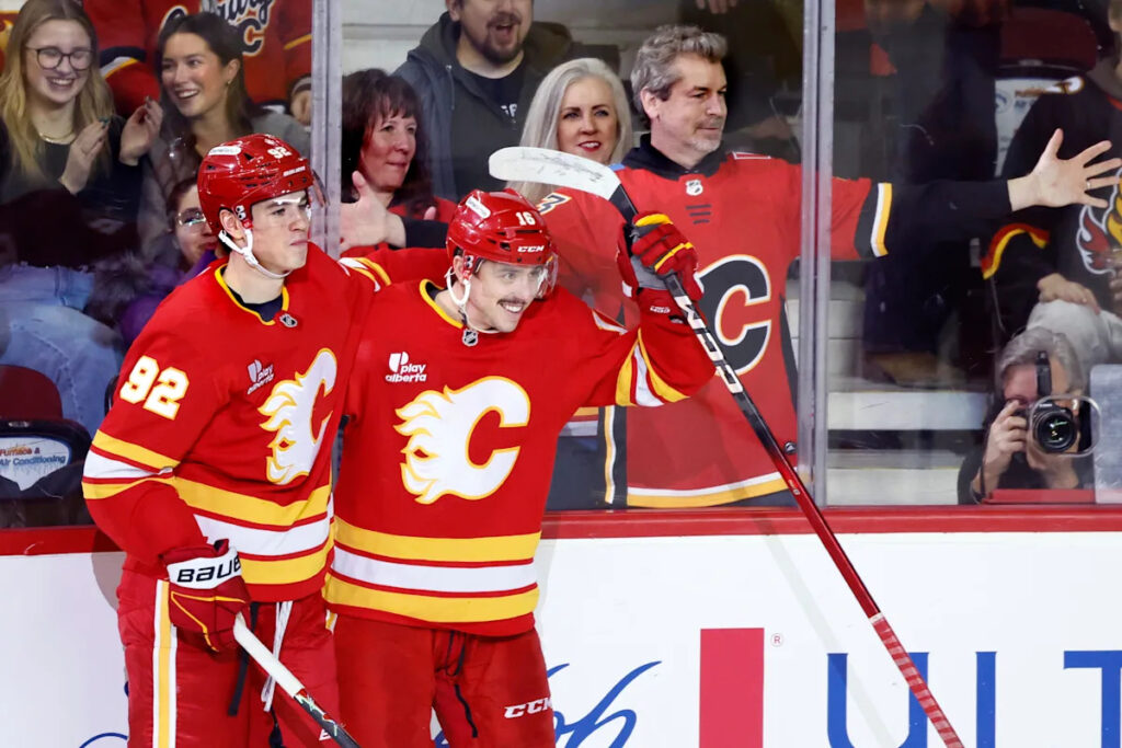 Flames ignite their offence, burn Canucks 7-3 Flames ignite their offence, burn Canucks 7-3